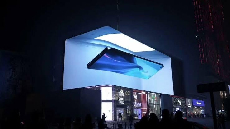 A picture of 3D Digital billboard SMD Screen displaying an add of mobile phone